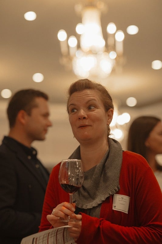 Trade partner enjoying a glass of wine